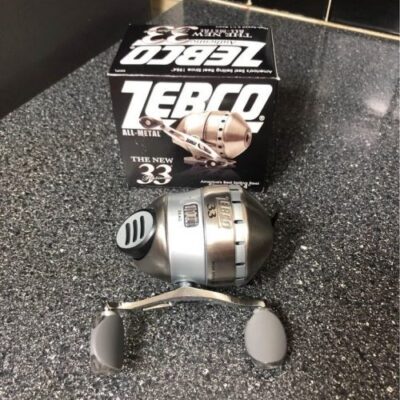 zebco 33 spincast reel on the ground after unboxing