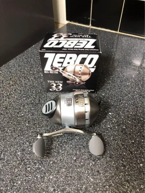 zebco 33 spincast reel on the ground after unboxing