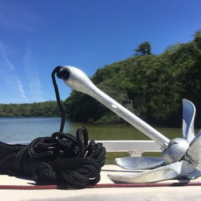 kayak anchor sitting on the edge of the water