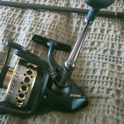 penn battle spinning reel sitting on a cloth during bench testing
