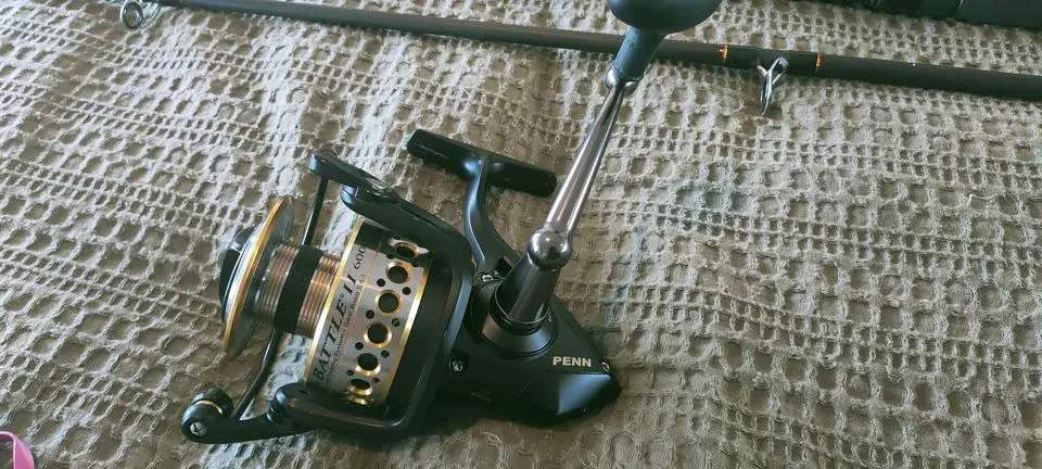 penn battle spinning reel sitting on a cloth during bench testing