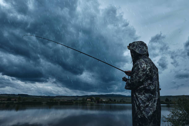 fishing in the rain wearing a jacket