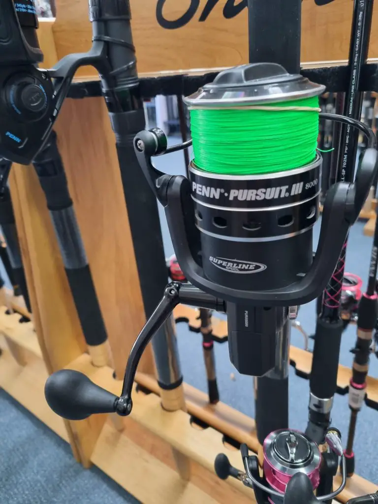 Penn Pursuit spinning reel spooled with green fishing line