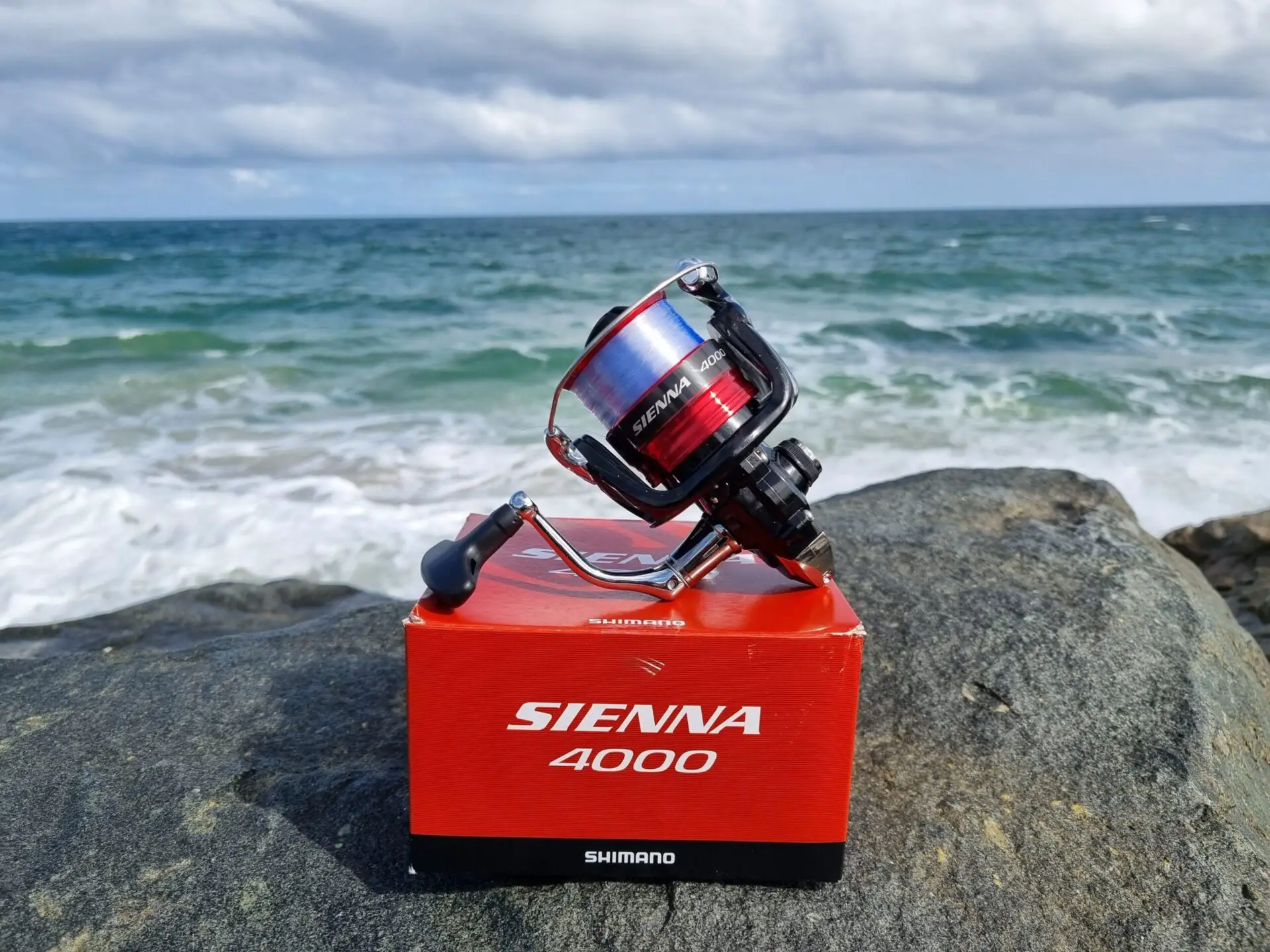 Shimano Sienna unboxed in front of the ocean