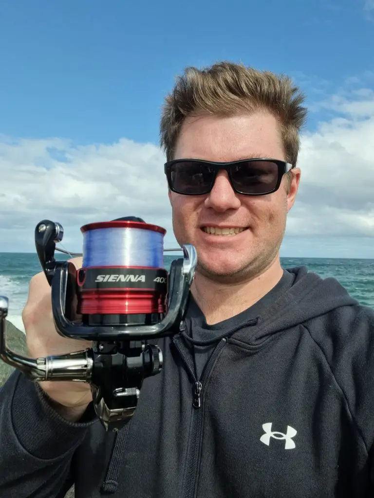 Russ Egan holding up the Shimano Sienna to the camera