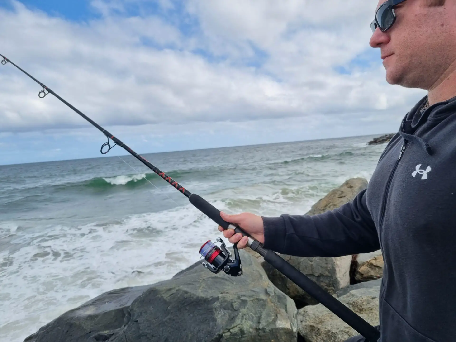 Russ Egan testing out a Shimano Sienna FG 4000 reel with an Ugly Stik Platinum rod fishing in the ocean from the shore