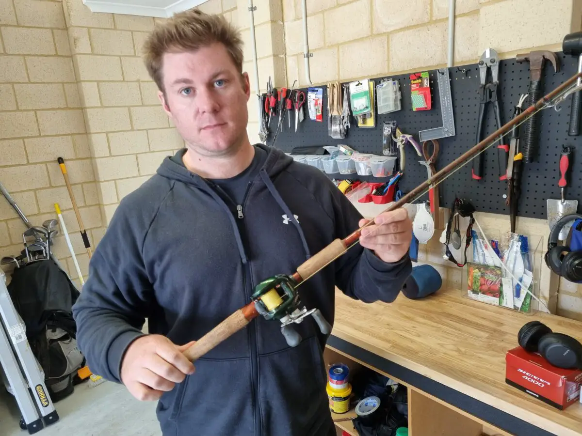 Russ Egan holding Shimano curado baitcasting reel with graphite casting rod