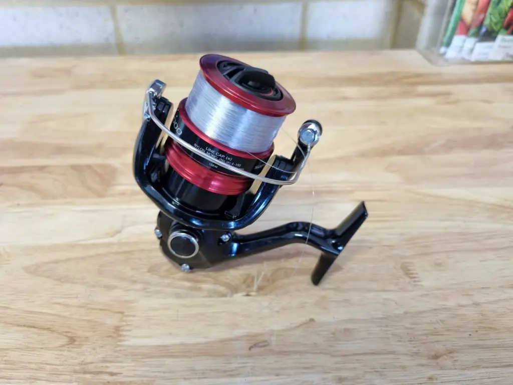 Shimano sienna sitting on a bench focused on the handle tightening knob