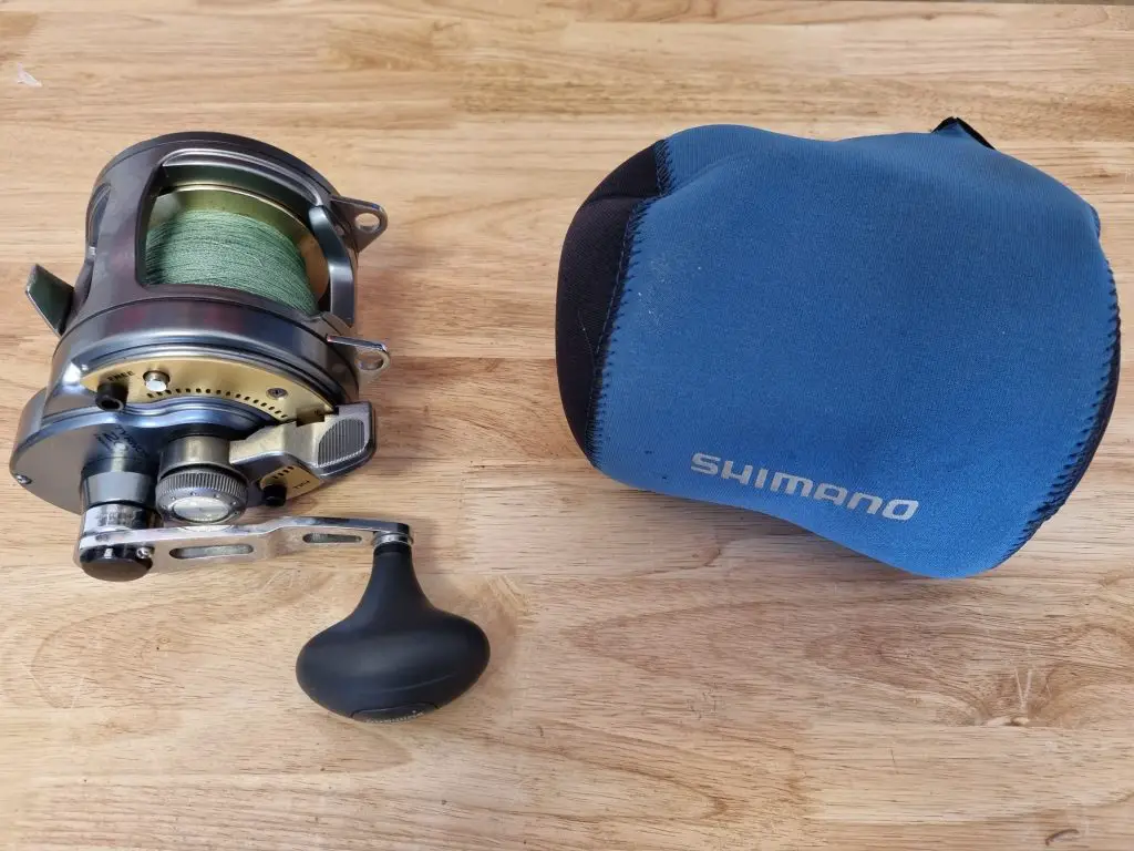 Shimano Tyrnos Reel being put into a neoprene reel cover