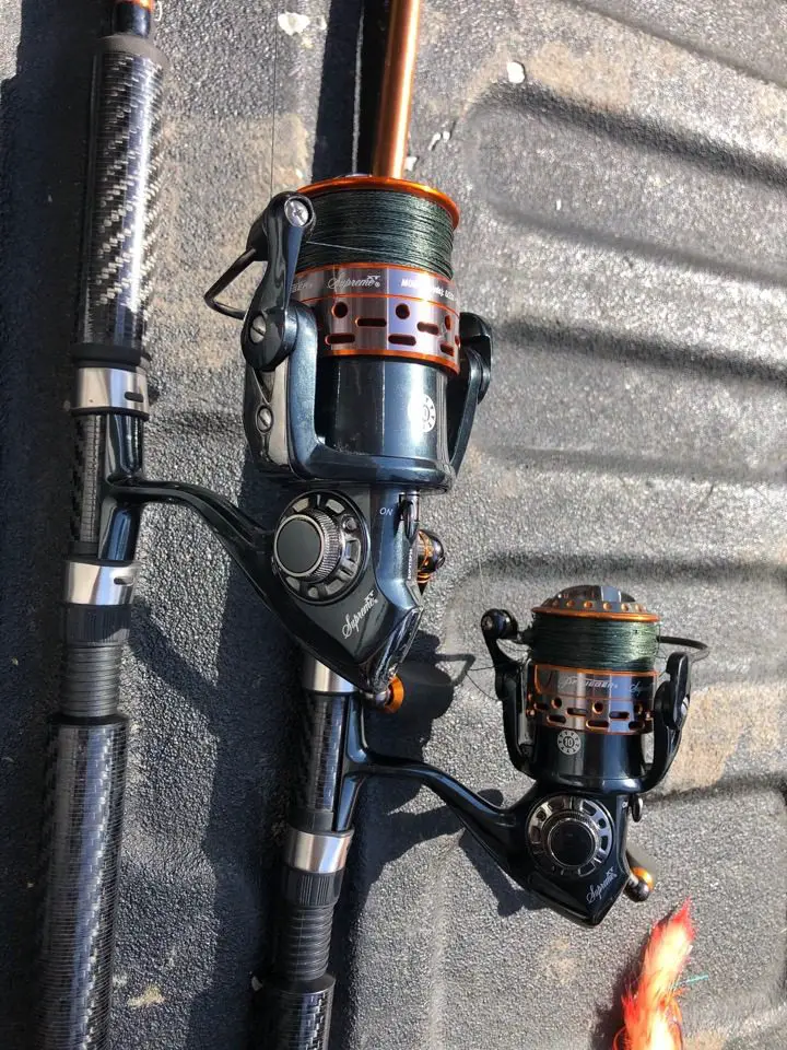 Two Pflueger President reels spooled with braid for field testing